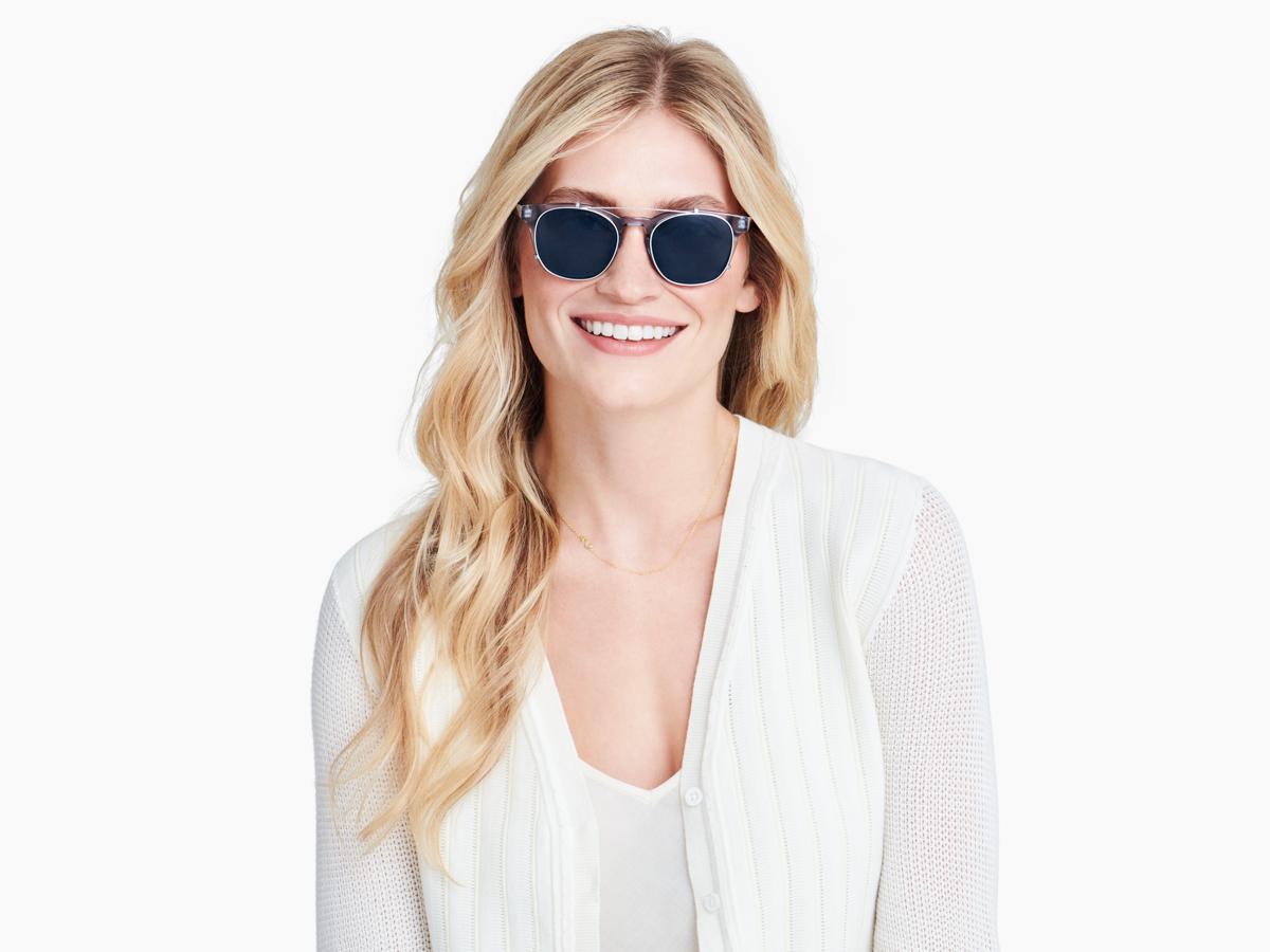 Side view of Felix Clip-On Medium in Polished Silver with Blue Lenses