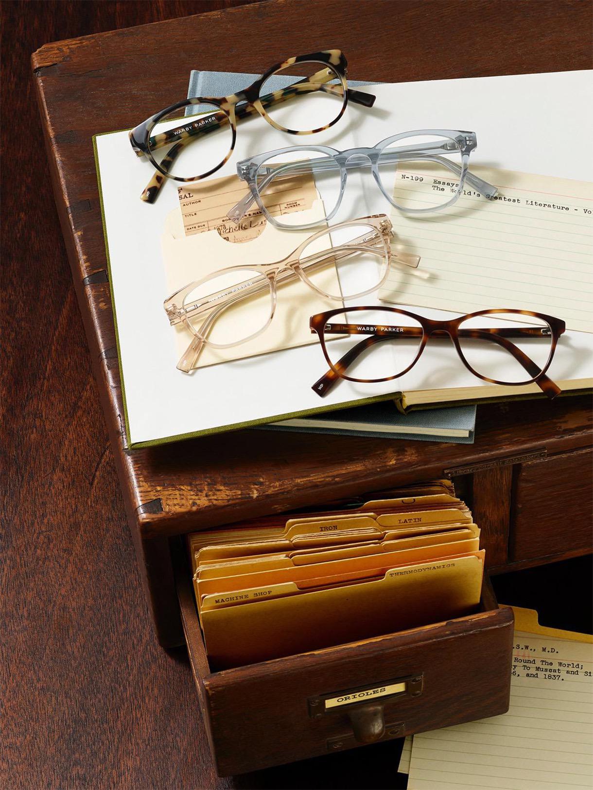 Warby Parker frames on old desk