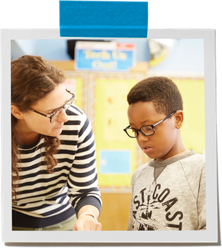 someone helping a child with glasses